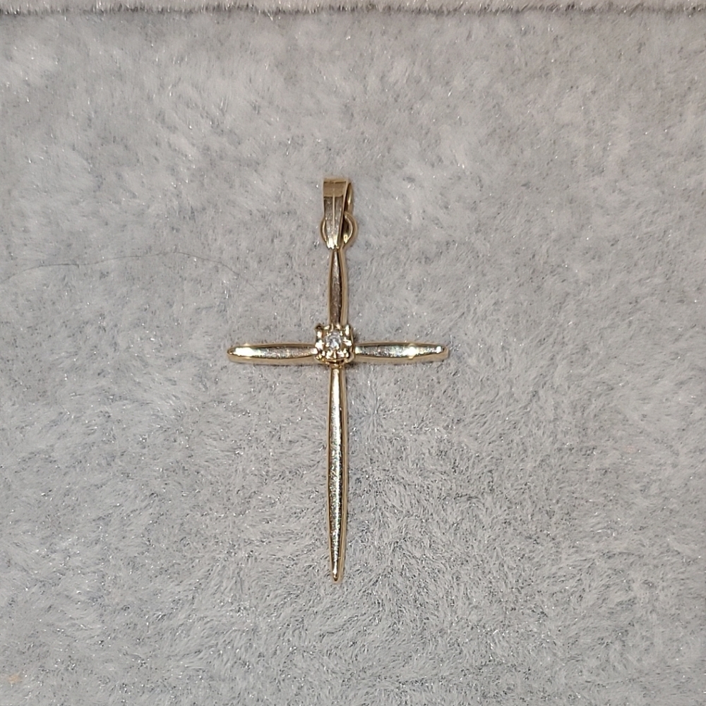 Diamond cross set in 14kt yellow gold pendant